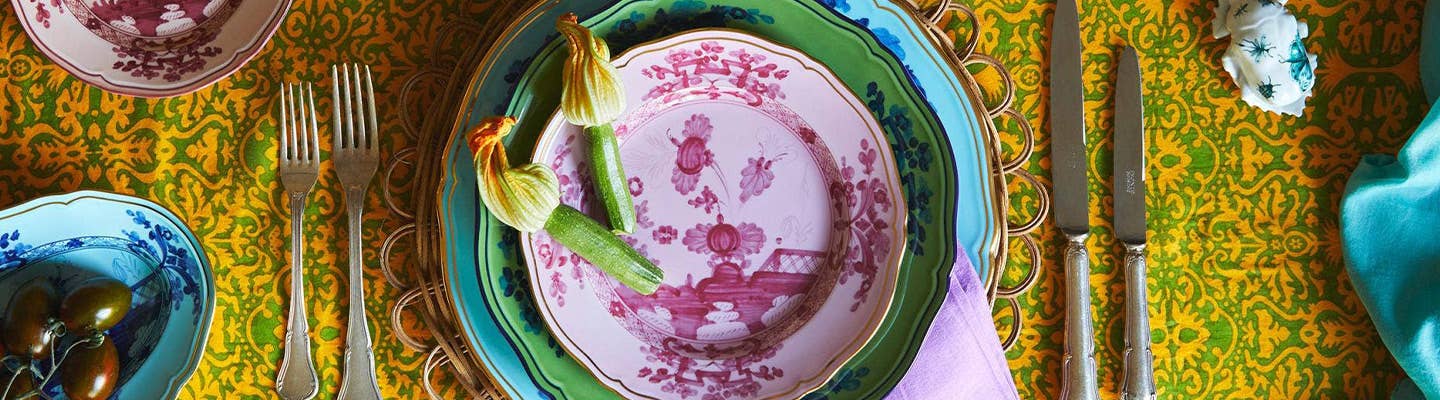 A colorful place setting featuring Ginori 1735's Oriente Italiano dinnerware collection A colorful place setting featuring Ginori 1735's Oriente Italiano dinnerware collection