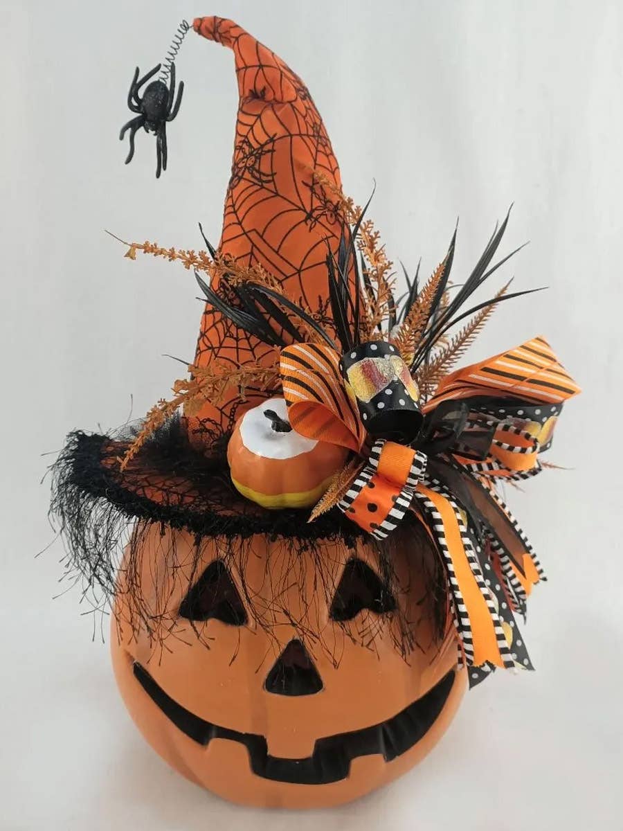 Halloween pumpkins featuring the Karen Didion Lighted Pumpkin with orange hat