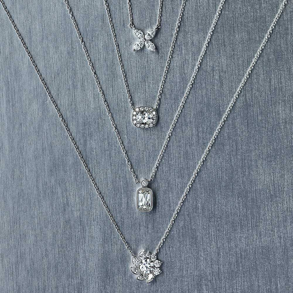 Shop our collection of Kwiat Jewelry, including a variety of diamond necklaces as shown on a silver background